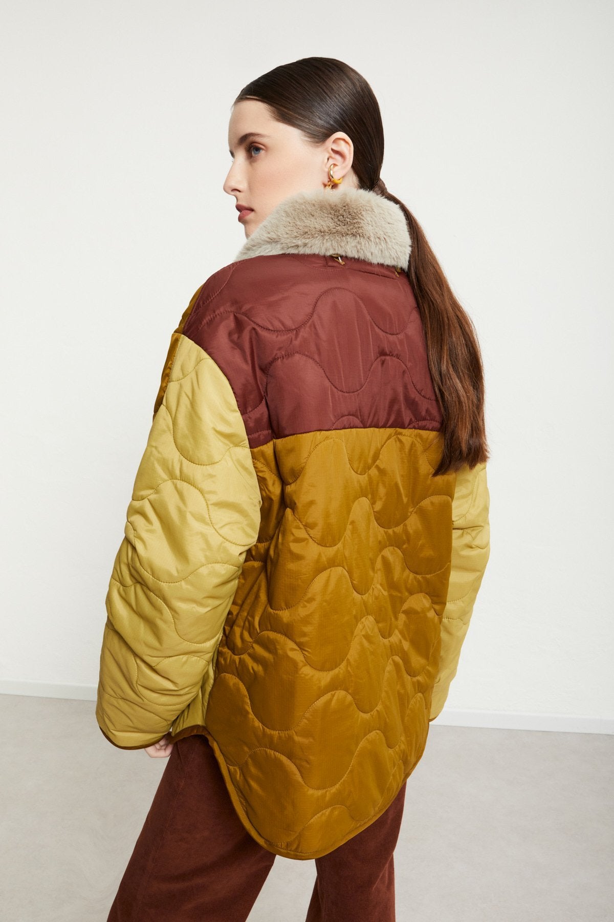 Padded and quilted down jacket